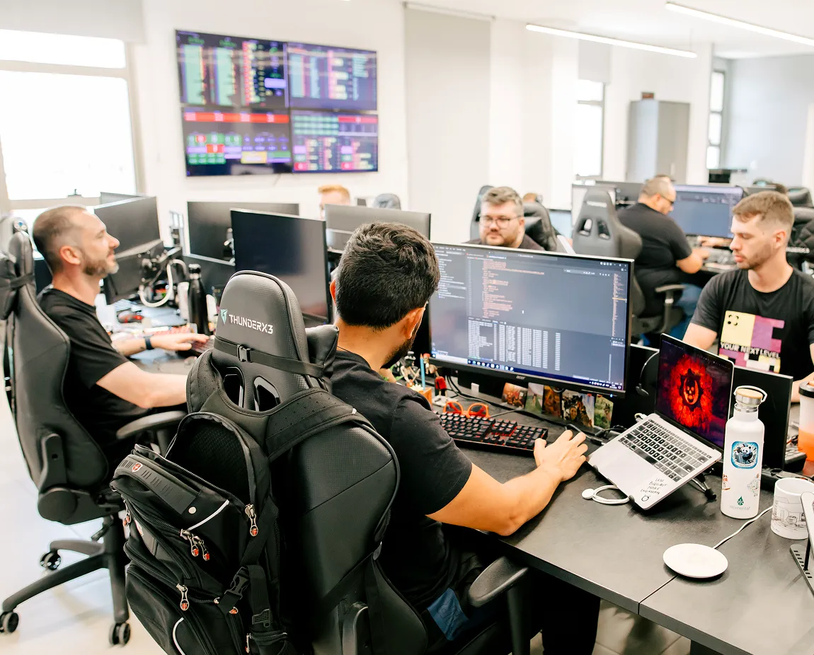 Optidata engineers and SREs on shift in the operations room