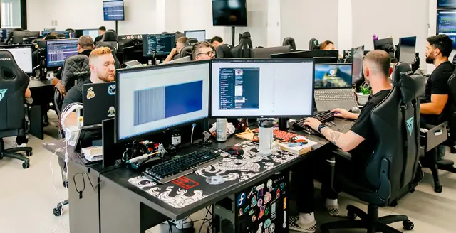 Optidata engineers working in the open office