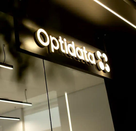 Illuminated Optidata sign at the office entrance